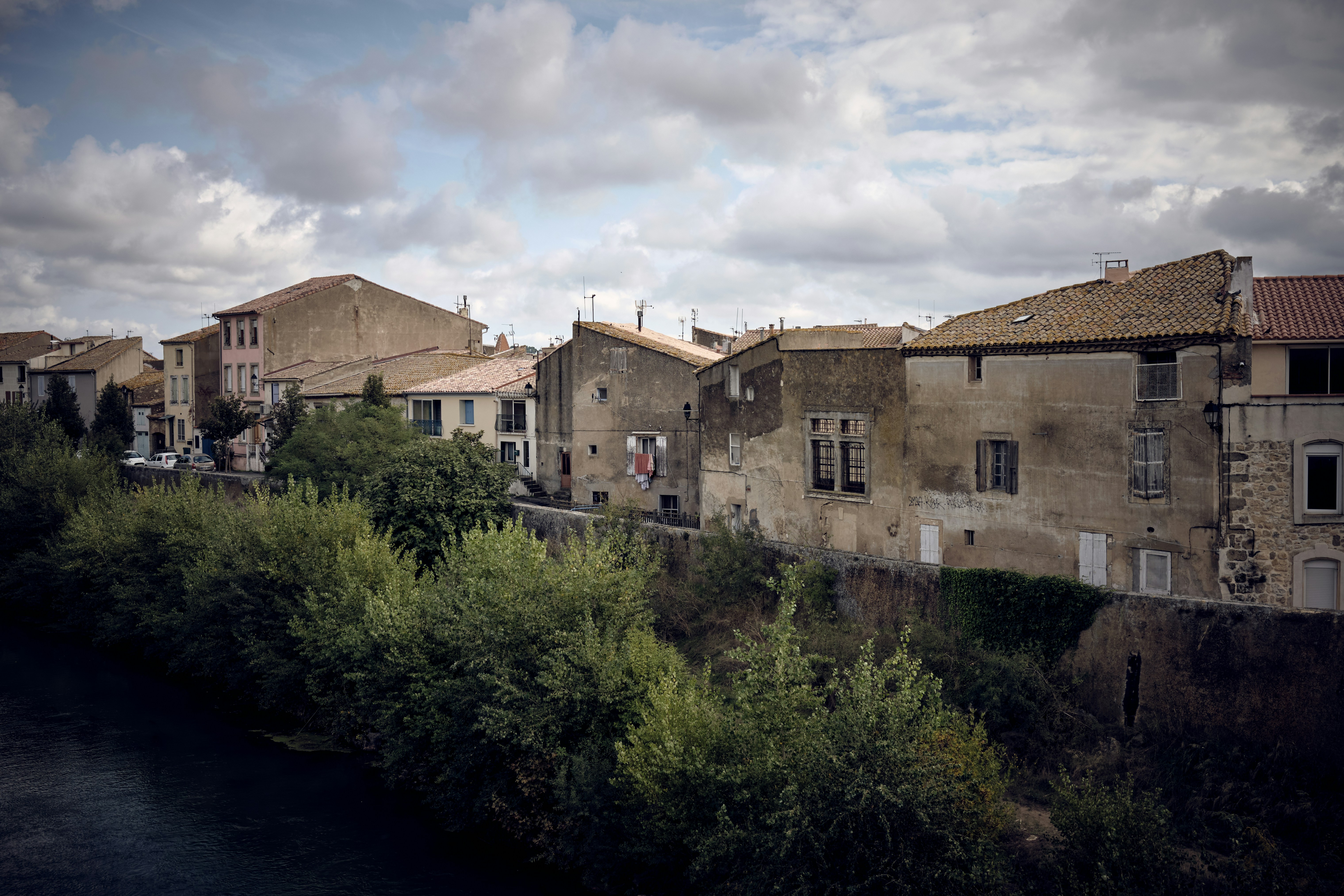 a river running through a city next to tall buildings