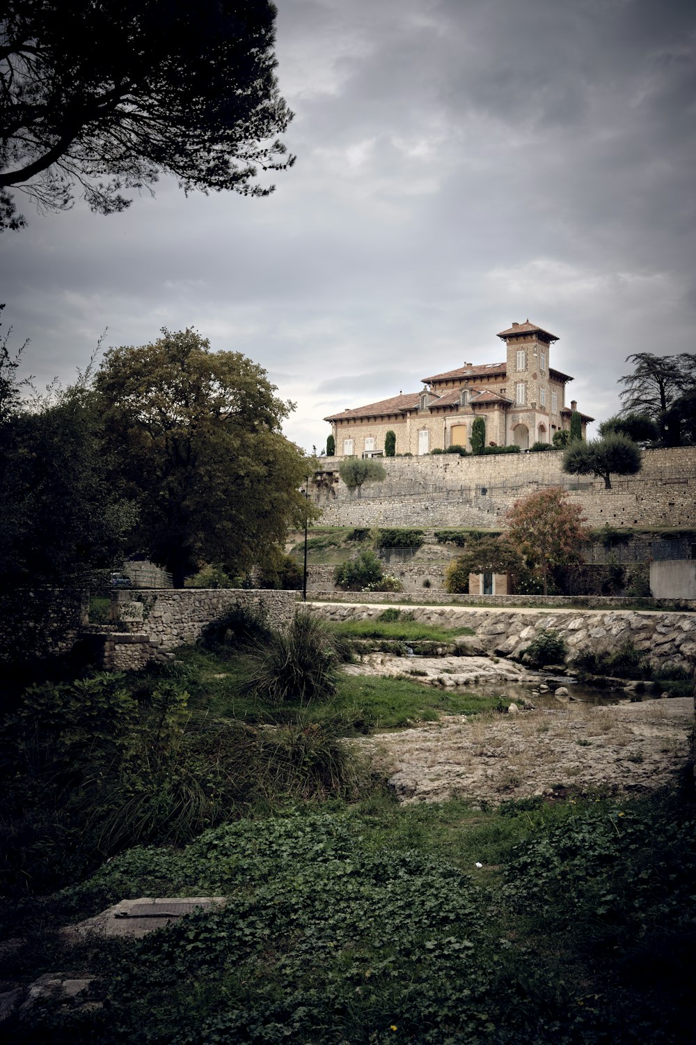 a large house sitting on top of a hill