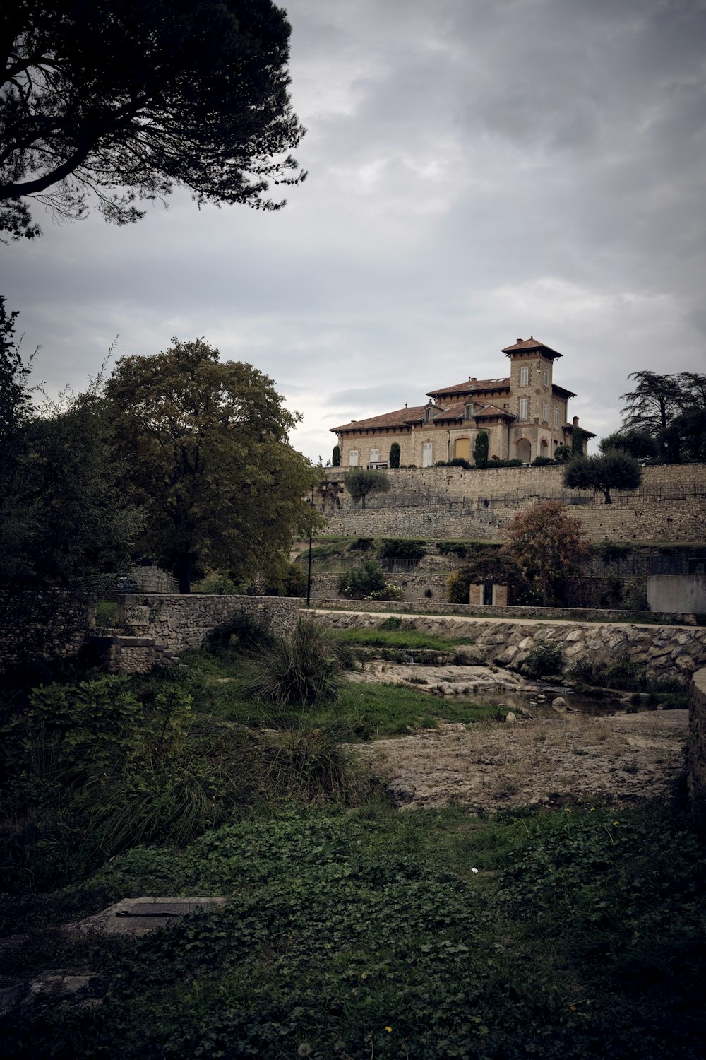 a large house sitting on top of a hill