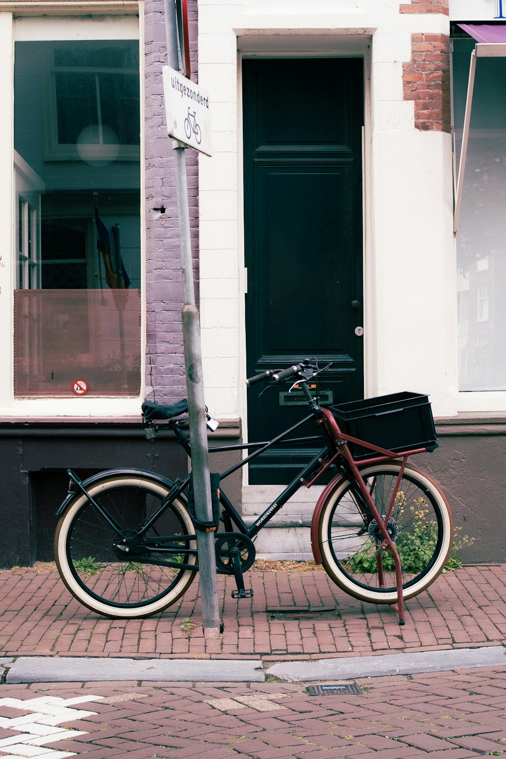 a bicycle parked on the side of a street