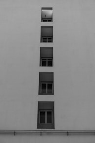 a black and white photo of a tall building