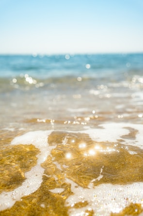 A close-up of a peaceful beach with gentle waves.