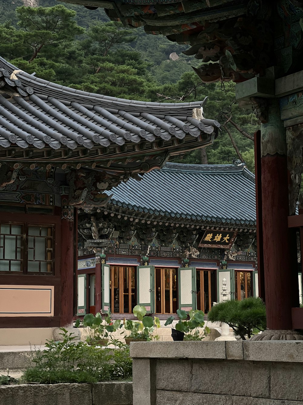 a chinese building with a clock on the front of it