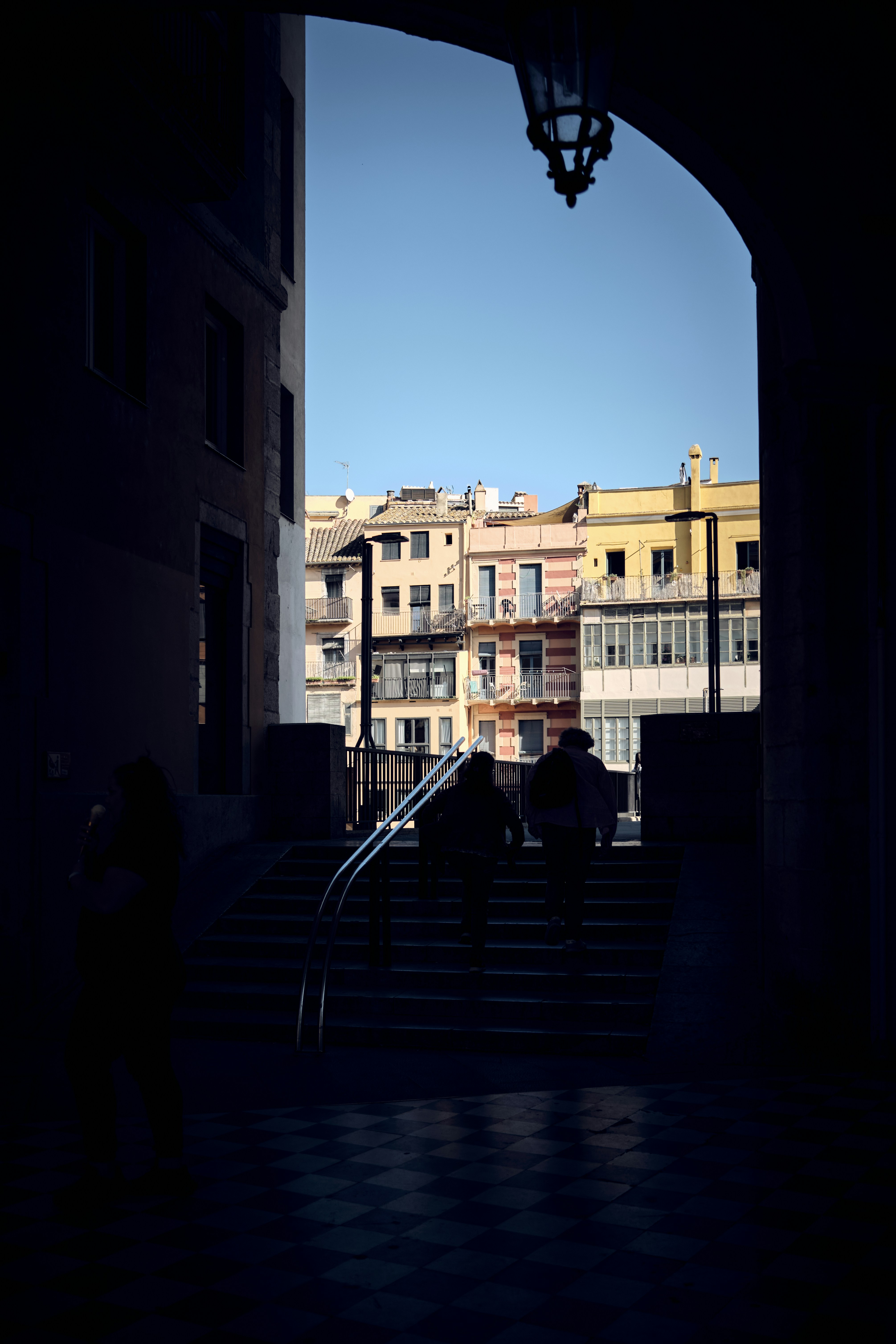 a group of people walking up a flight of stairs
