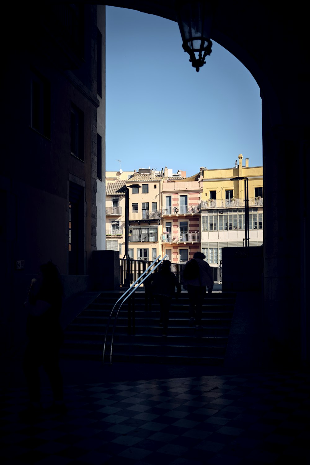 a group of people walking up a flight of stairs