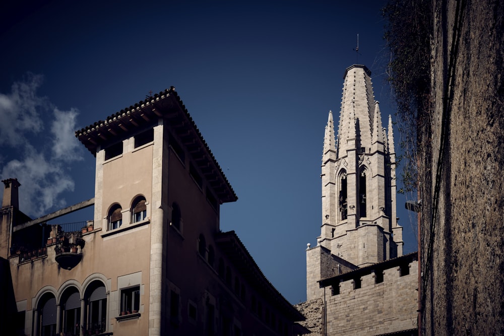 a tall building with a steeple next to it