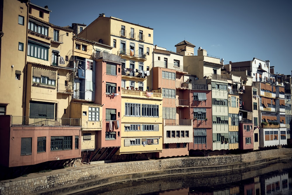 a group of buildings next to a body of water