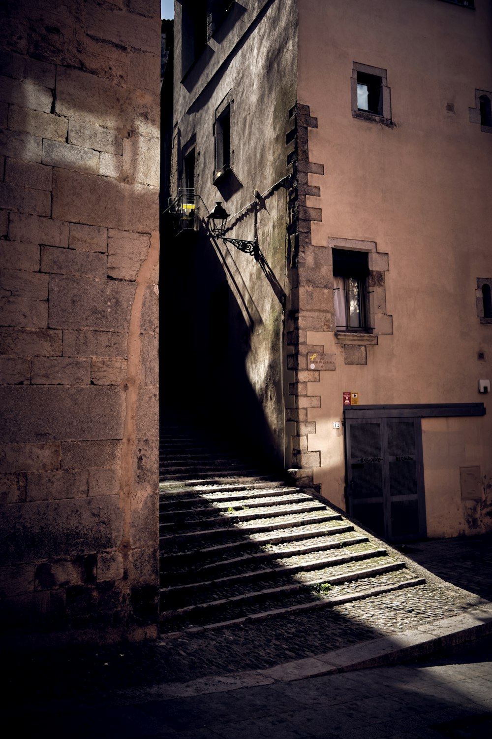 a stone building with stairs leading up to it