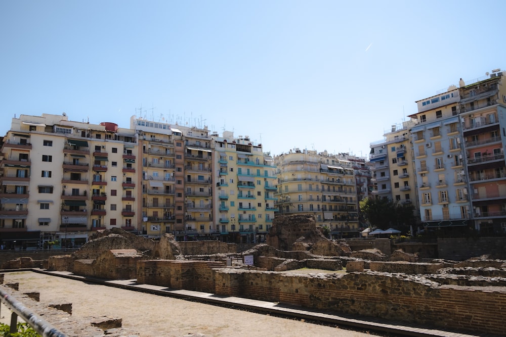 a group of buildings in a city next to a beach