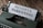 A close-up of a vintage typewriter with a sheet of paper inserted, displaying the text 'MINDFUL PARENTING' in bold letters. The typewriter is placed on a wooden surface.