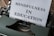 A vintage typewriter with a sheet of paper that has the words 'Mindfulness in Education' typed on it. The typewriter is an old-fashioned, dark green model with metal components, placed on a wooden surface.