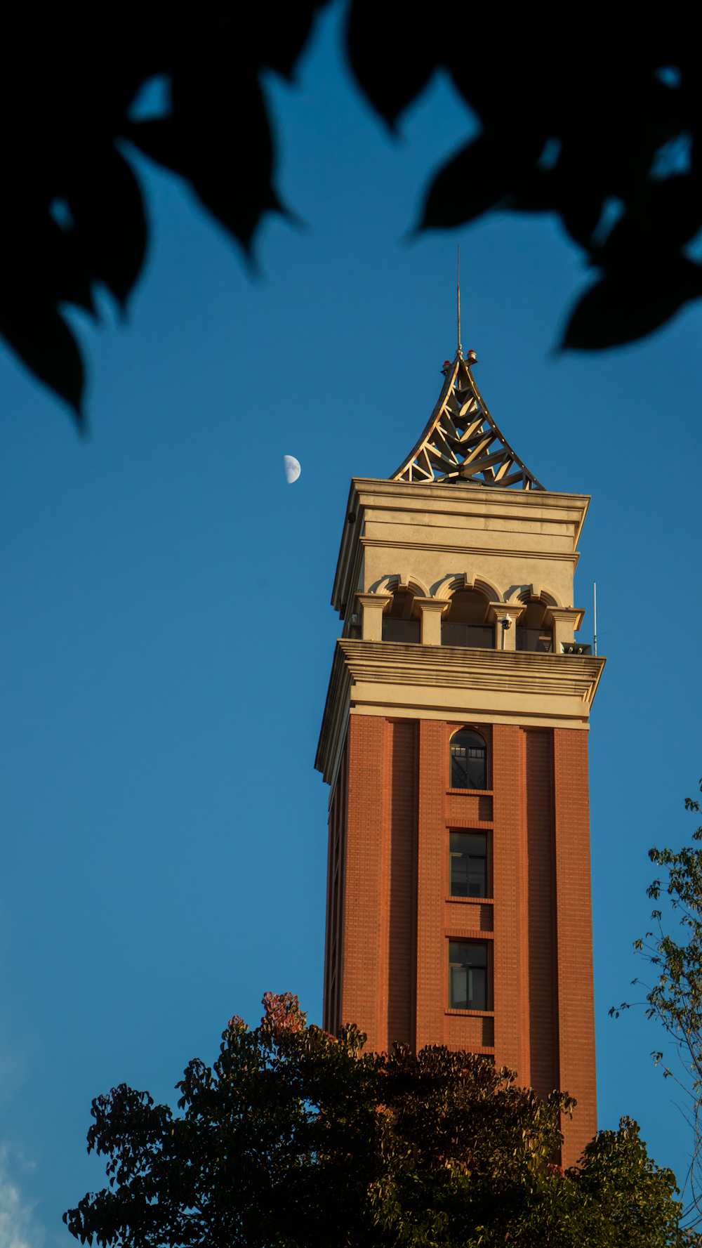 a tall tower with a clock on the top of it