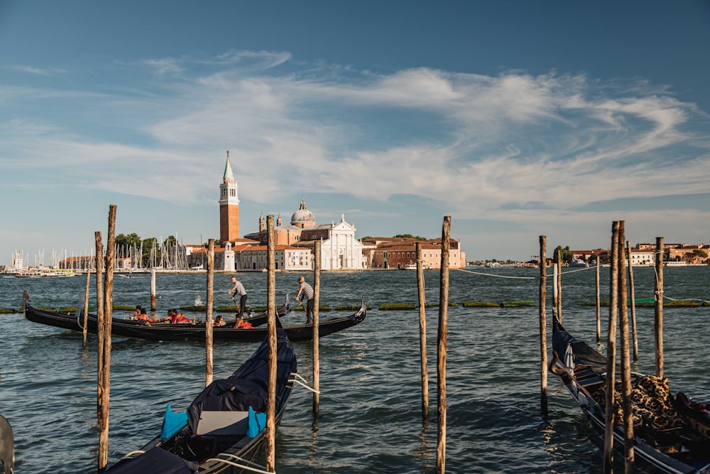 a couple of gondolas that are sitting in the water