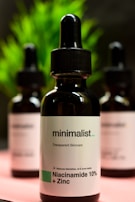 A dropper releasing niacinamide serum onto a glass surface, emphasizing clarity and purity.