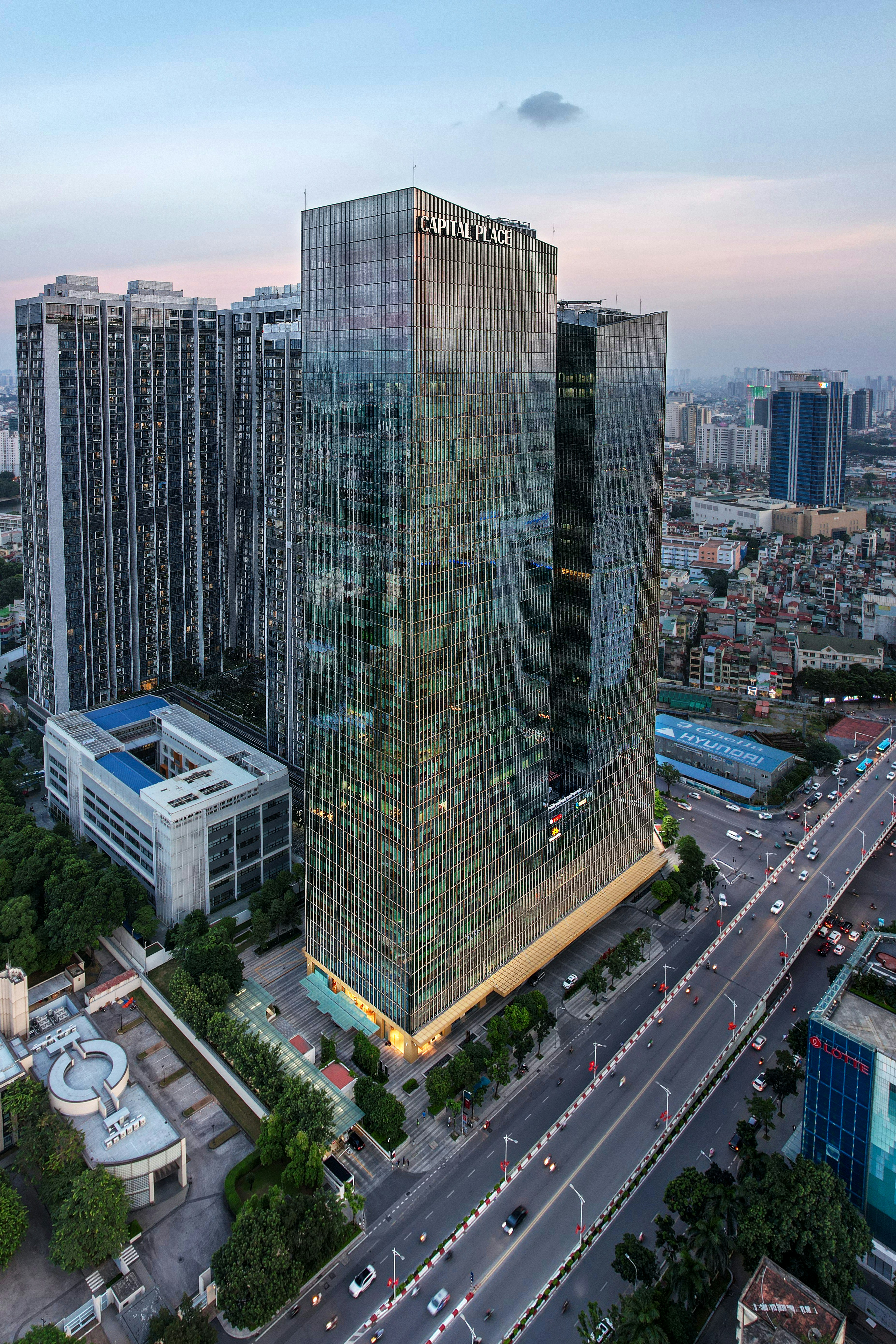 an aerial view of a city with tall buildings