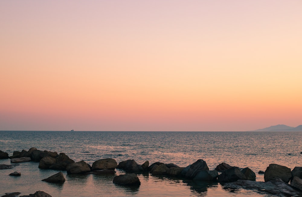 a large body of water surrounded by rocks