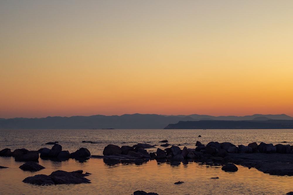 a large body of water surrounded by rocks