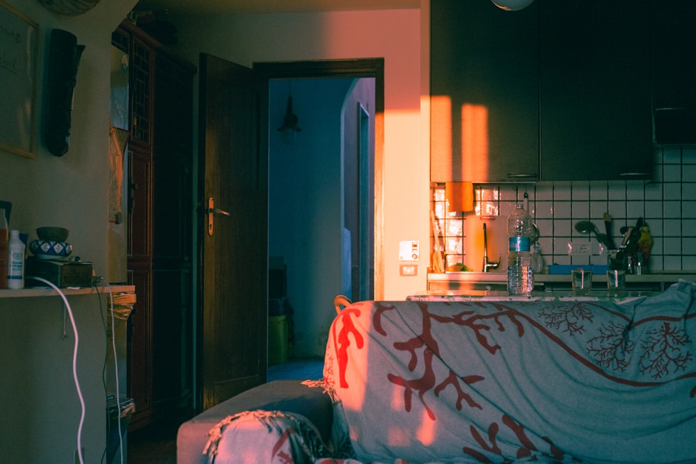 a living room filled with furniture and a window