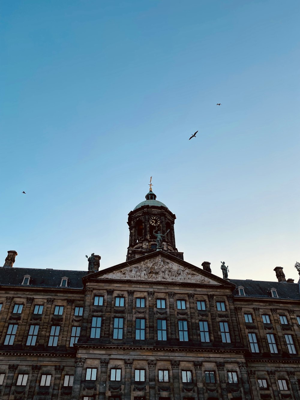 a large building with a clock on the top of it