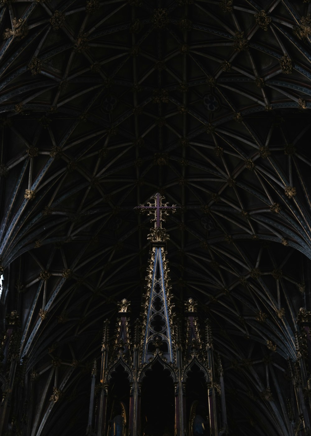 a large cathedral with a cross hanging from it's ceiling