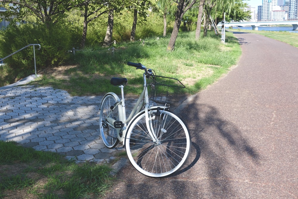 a bicycle parked on the side of a road