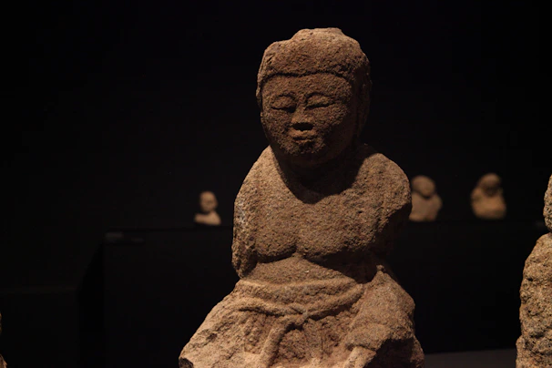 Close-up of handcrafted meditation sculptures with subtle shadows highlighting their elegant textures.