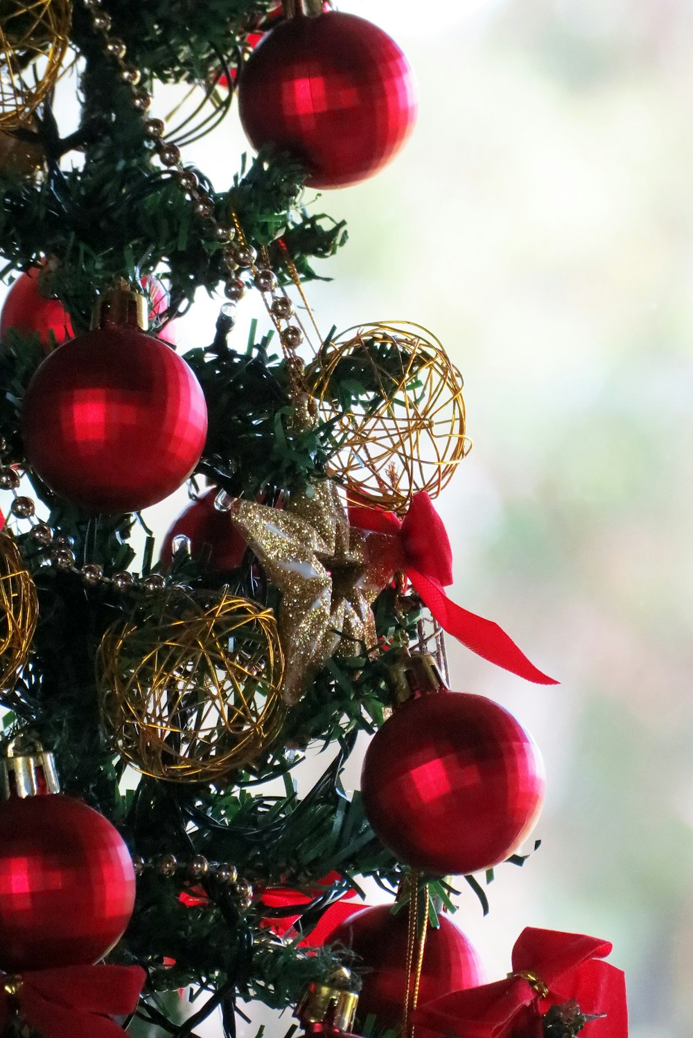 a close up of a christmas tree with ornaments