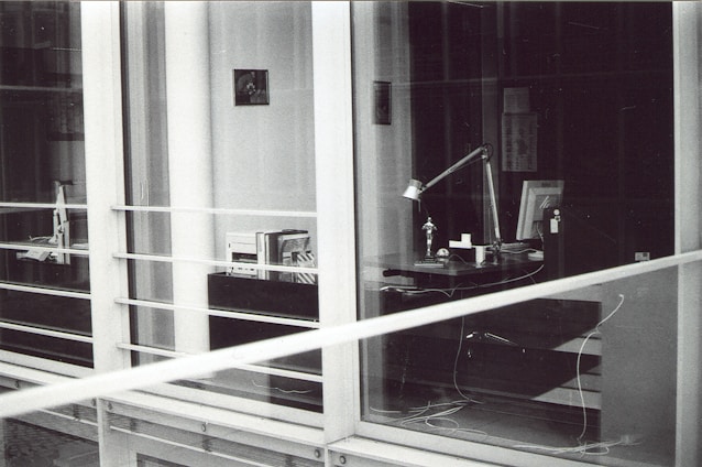 A professional law office with legal books and scales on a desk.