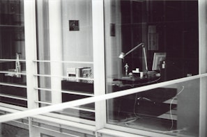 Interior view of a modern law office with bookshelves and a wooden desk.