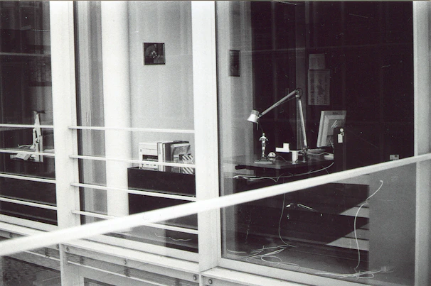 A panoramic view of the modern office space with sleek desks and legal books lining the shelves.