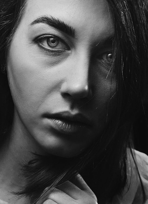 Close-up portrait of a story-driven character with expressive eyes and intricate linework