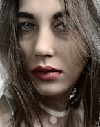 A close-up of a beautiful woman with captivating eyes.