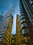 a couple of tall buildings sitting next to each other