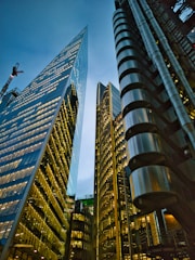 a couple of tall buildings sitting next to each other