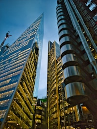 a couple of tall buildings sitting next to each other