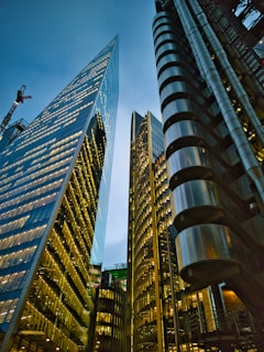 a couple of tall buildings sitting next to each other