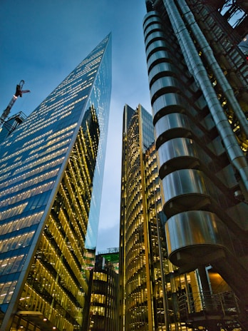 a couple of tall buildings sitting next to each other