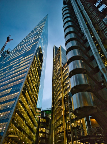a couple of tall buildings sitting next to each other