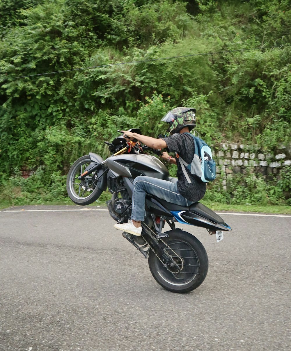 a man riding on the back of a motorcycle