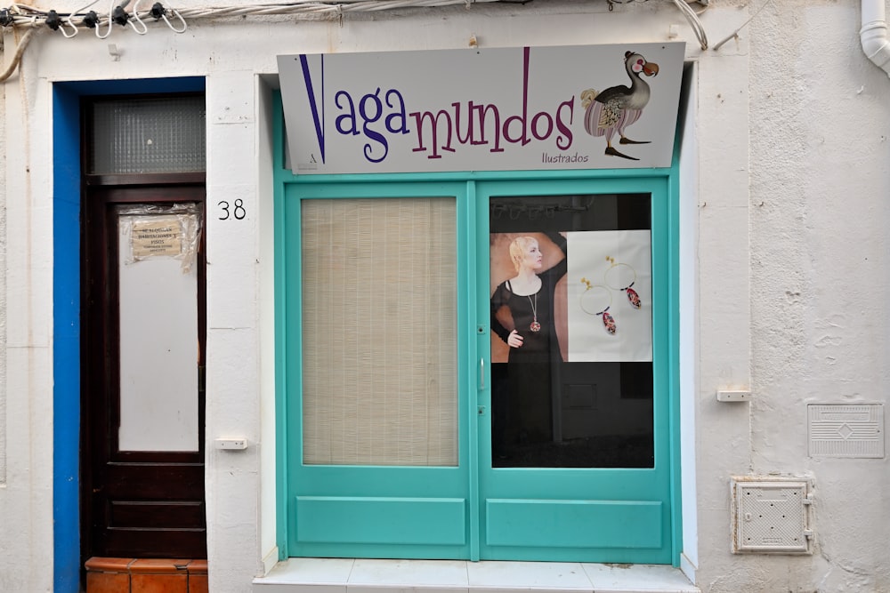 a store front with a blue door and window