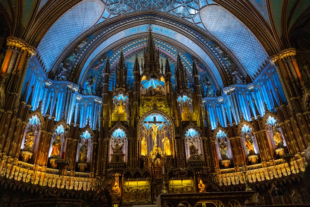 a large cathedral with a blue ceiling and stained glass windows