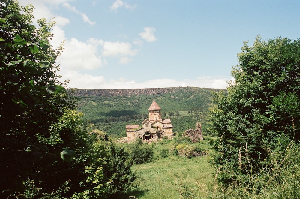 an old building in the middle of a forest