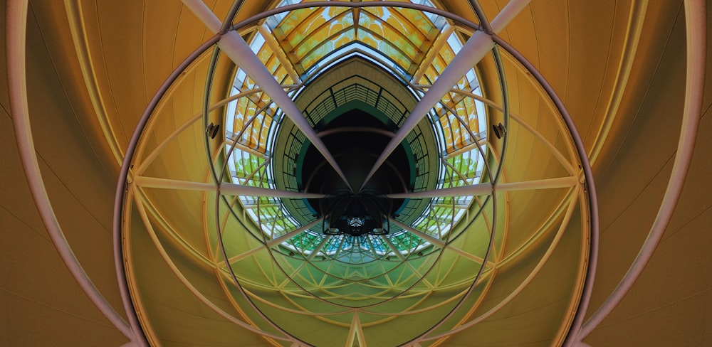 an abstract photograph of a yellow and green structure