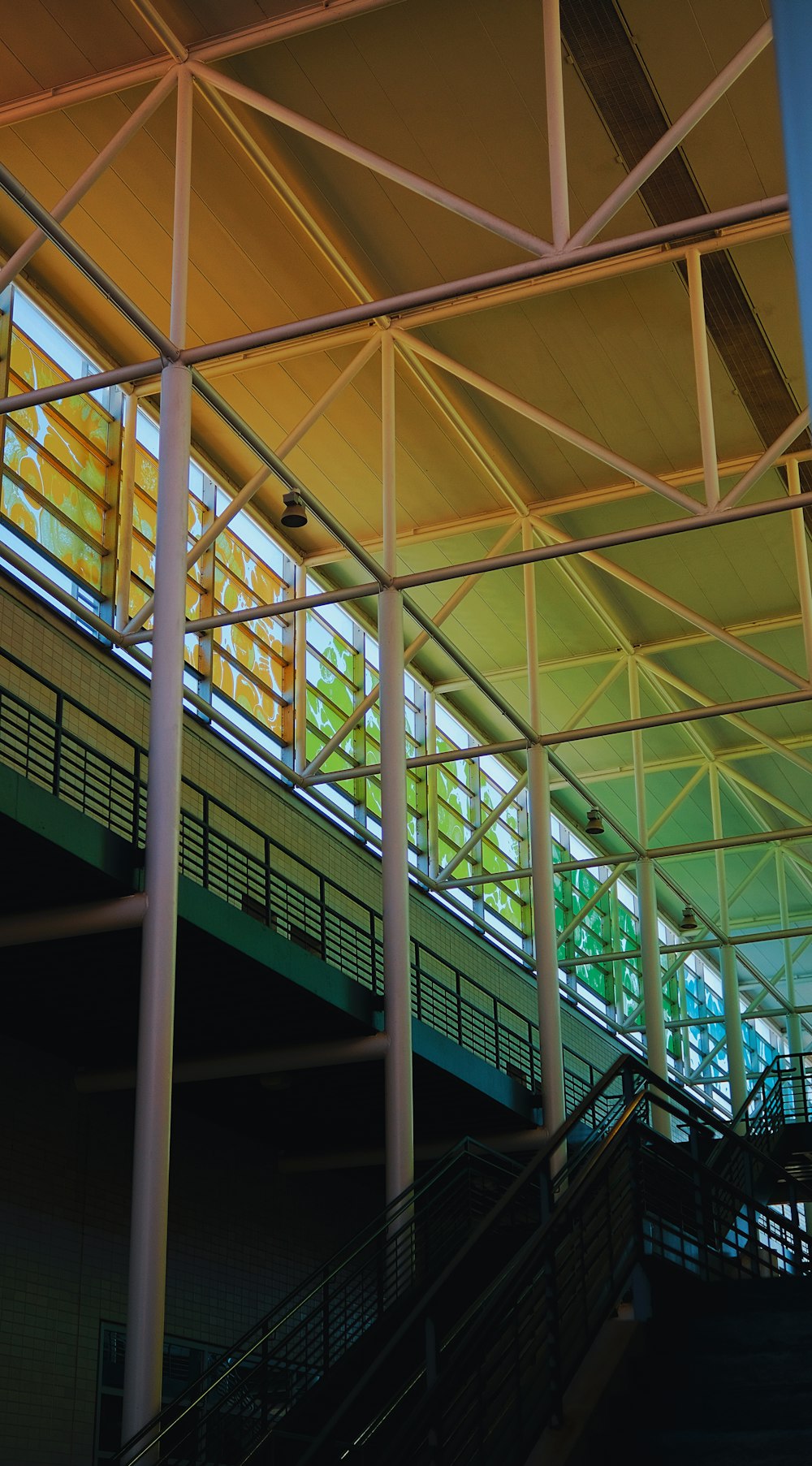 a large metal structure with a clock on top of it