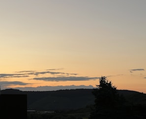 An abstract representation of a sunset over hills.