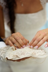 Close-up of a luxury saree being expertly cleaned and pressed.