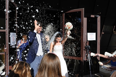 A newlywed couple receiving essential household items from the organization.