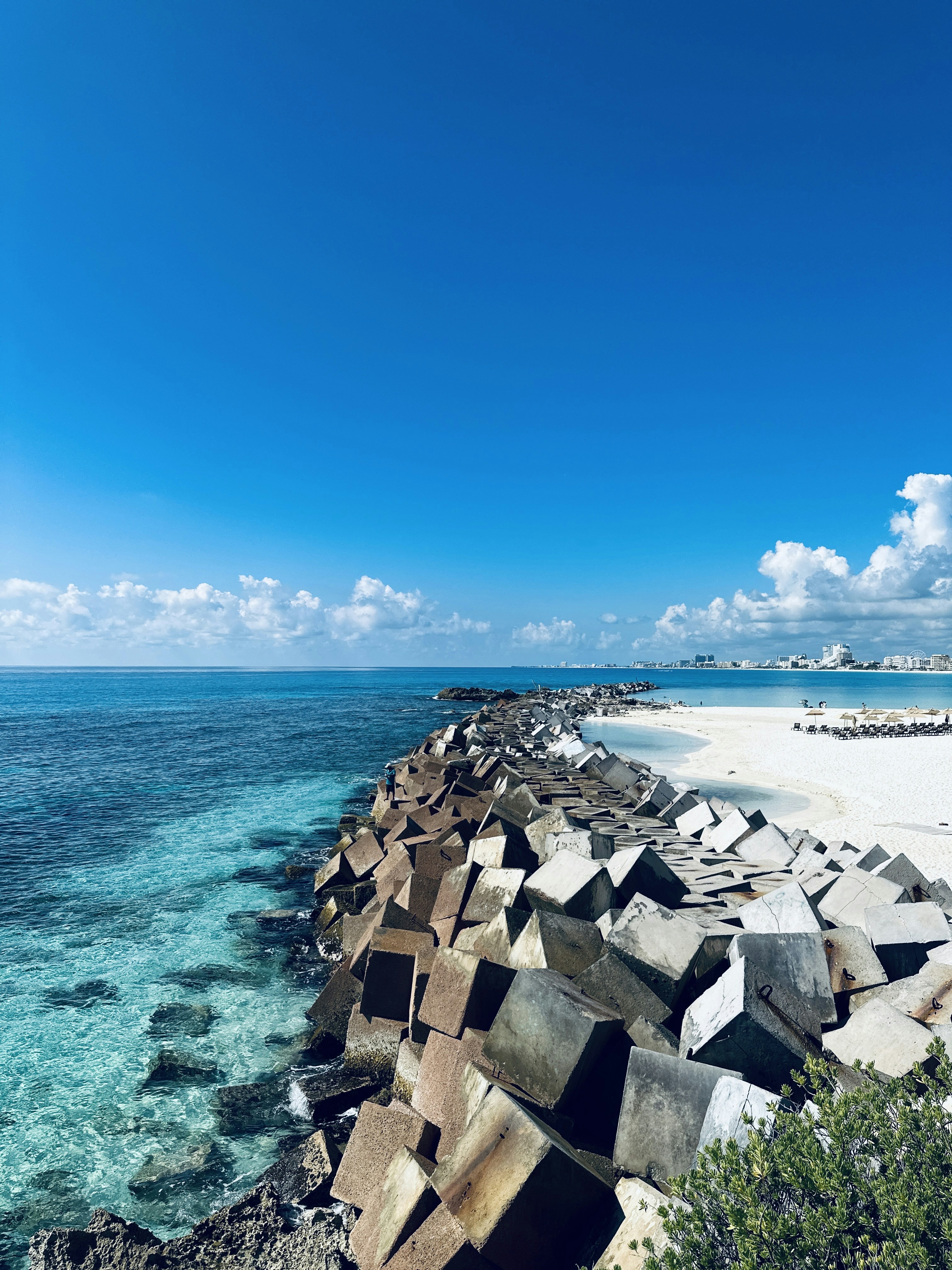a view of the ocean from a rocky cliff