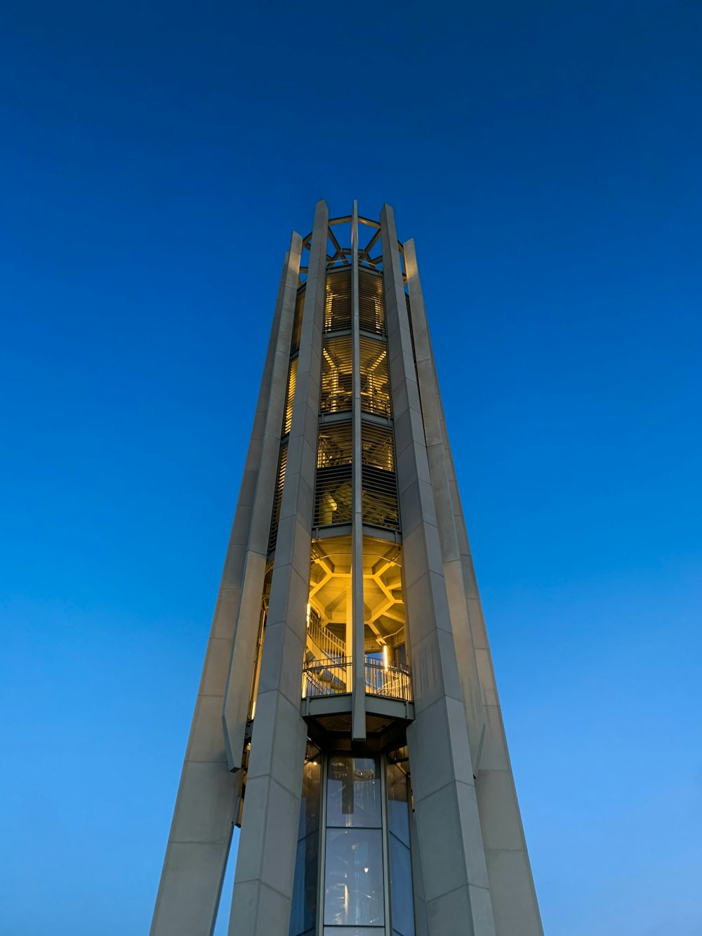 a very tall tower with a clock on it's side