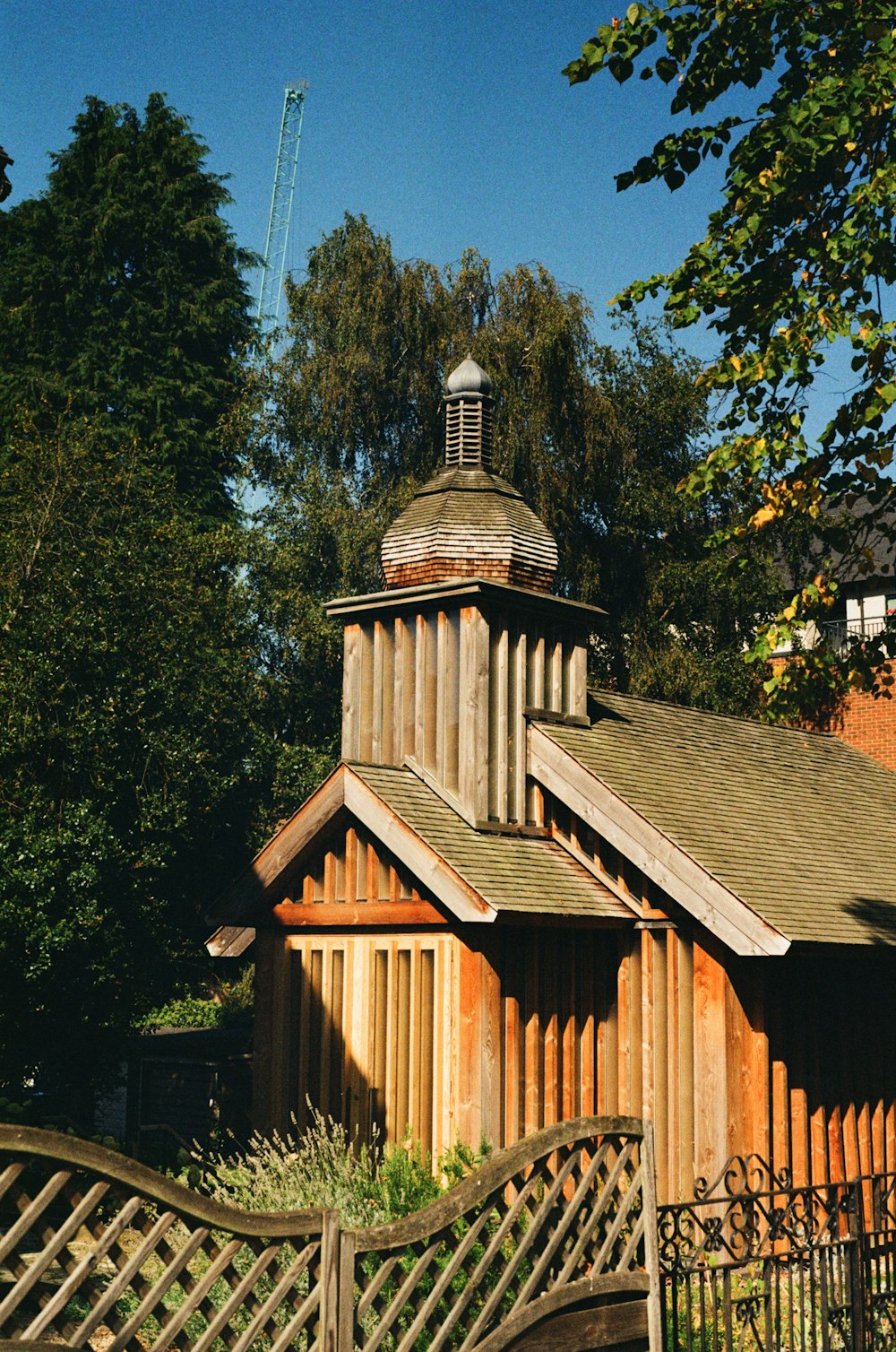 a wooden building with a steeple on top of it